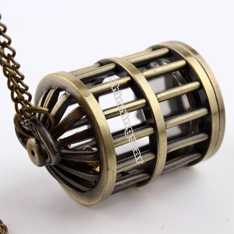 Montre pendentif mouvement quartz en forme de cage contenant un petit oiseau doré Ma montre à gousset