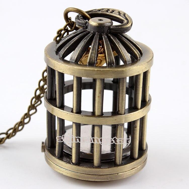 Montre pendentif mouvement quartz en forme de cage contenant un petit oiseau doré Ma montre à gousset